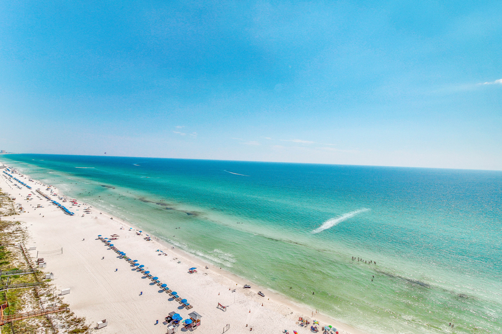 Sun-soaked oceanfront escape with pool, hot tub, central AC, & tennis court