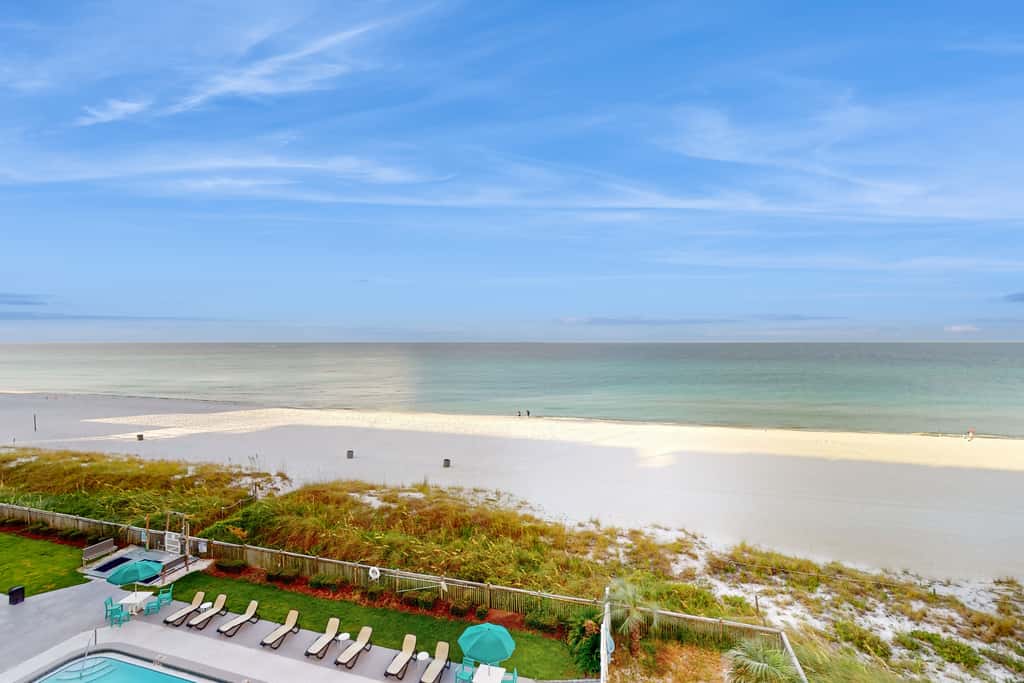 Oceanfront condo with shared pool, resort amenities, and private washer/dryer