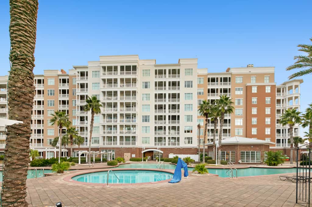 3rd-floor beach & pool-view condo with outdoor pool, hot tub, grills, balcony
