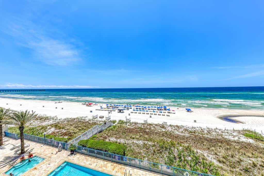 Gulf-front condo with balcony, beach access, hot tub, pool & gym