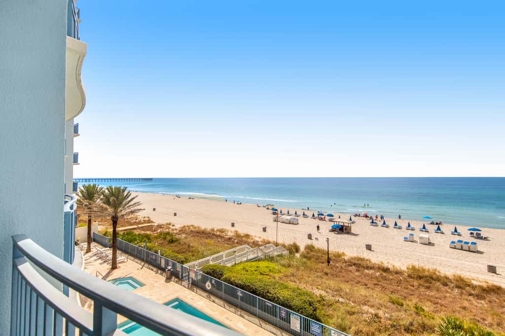 Gulf-front condo with seasonal beach service, pool, hot tub & gym