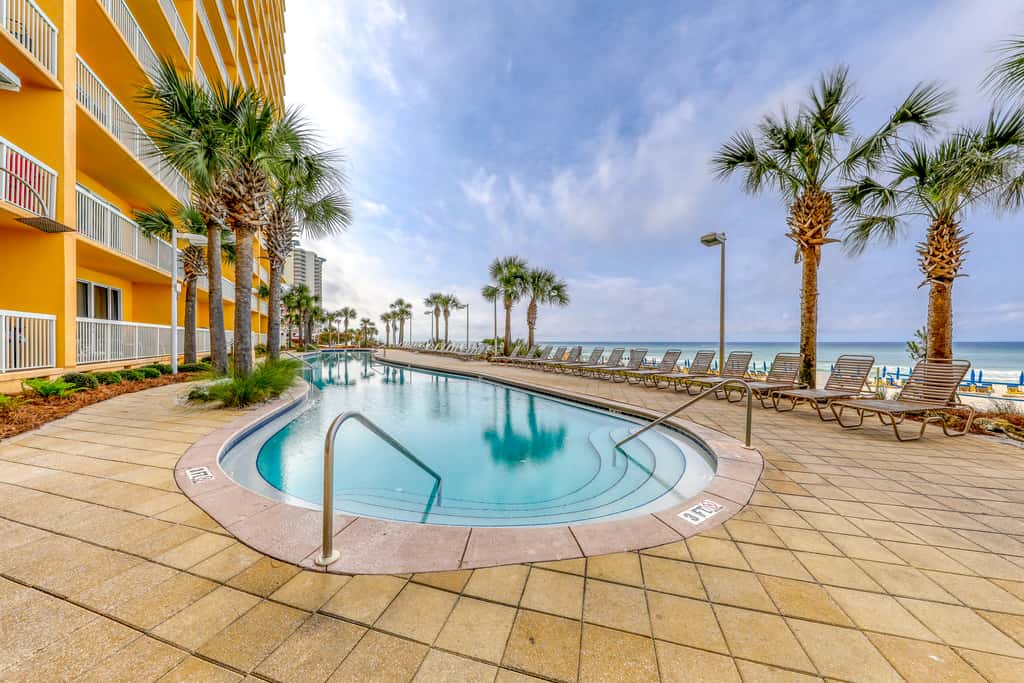Beach-view, high-rise condo with pool - central location