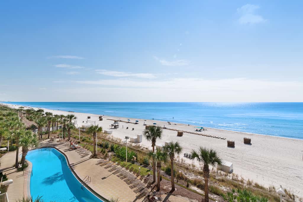 Tropical touches abound with balcony, pools, gym & beach access