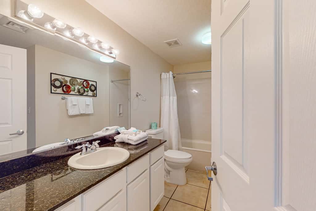 Tropical touches abound with balcony, pools, gym & beach access