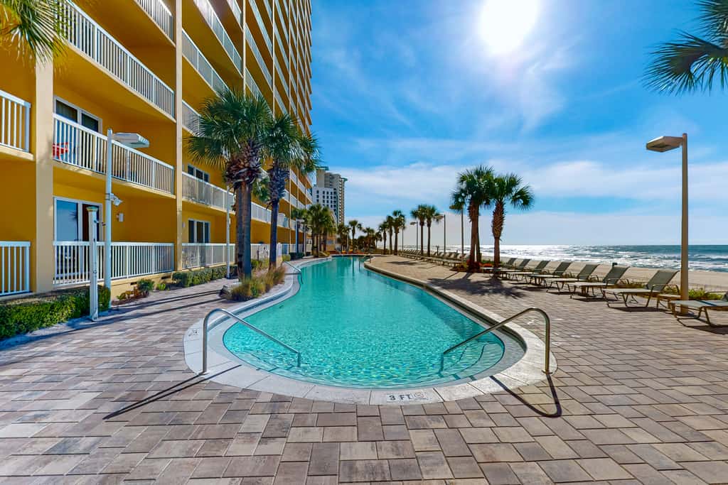 Tropical touches abound with balcony, pools, gym & beach access