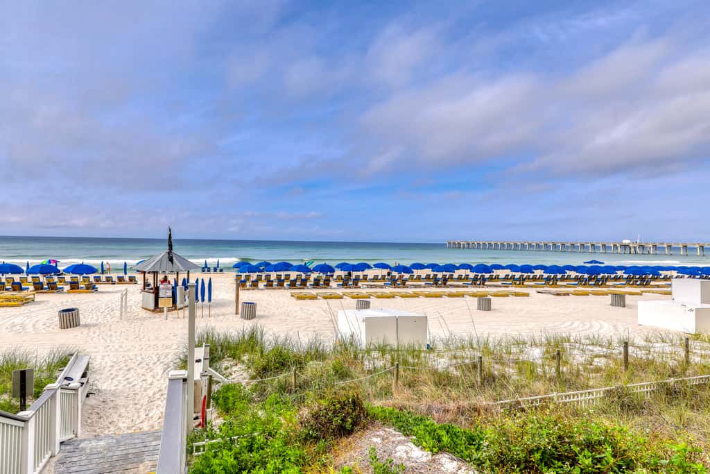 Tropical touches abound with balcony, pools, gym & beach access