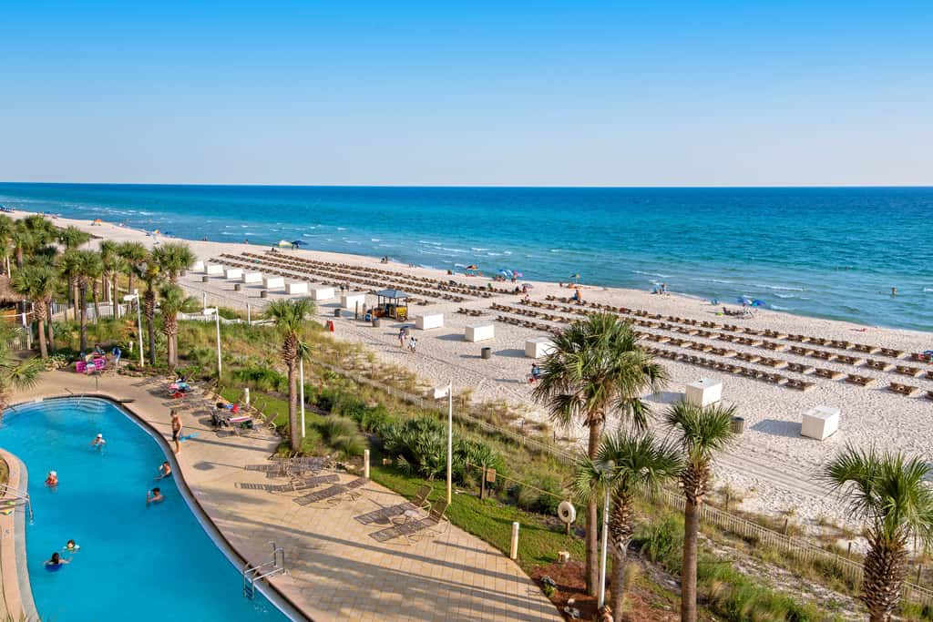 Tropical touches abound with balcony, pools, gym & beach access