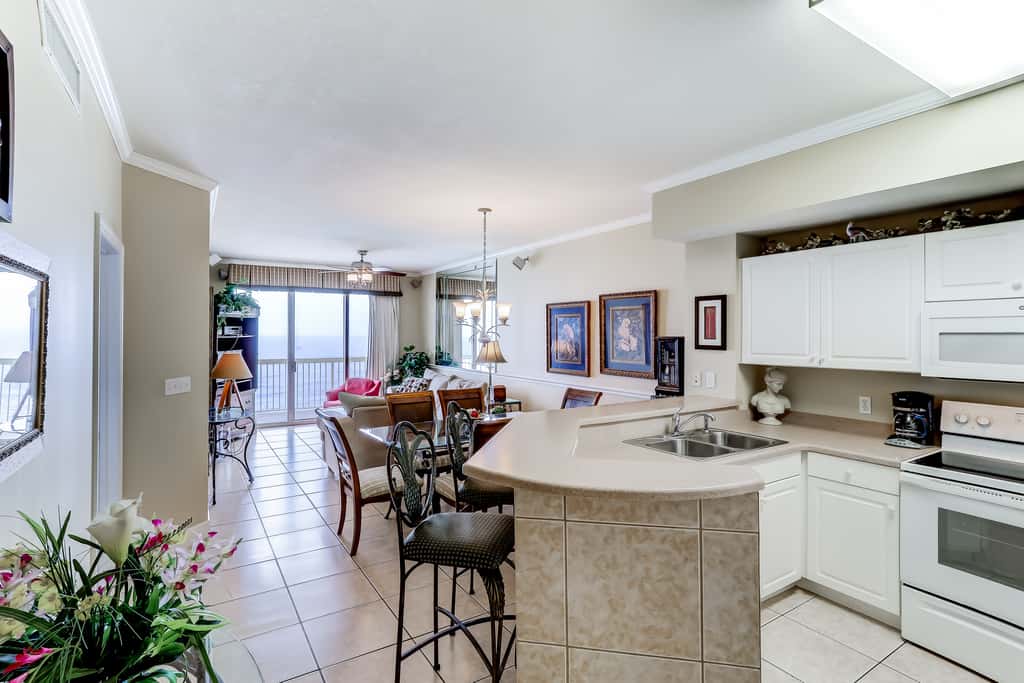 Eclectic gulf front condo with free WiFI, two pools, hot tub, & easy beach access