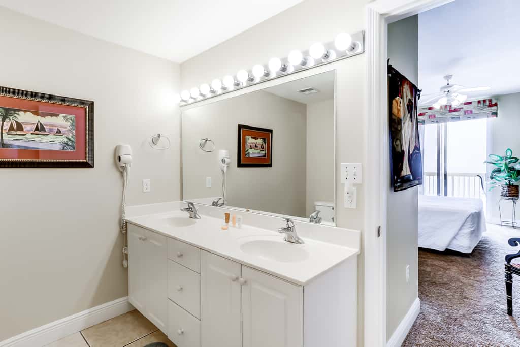 Eclectic gulf front condo with free WiFI, two pools, hot tub, & easy beach access