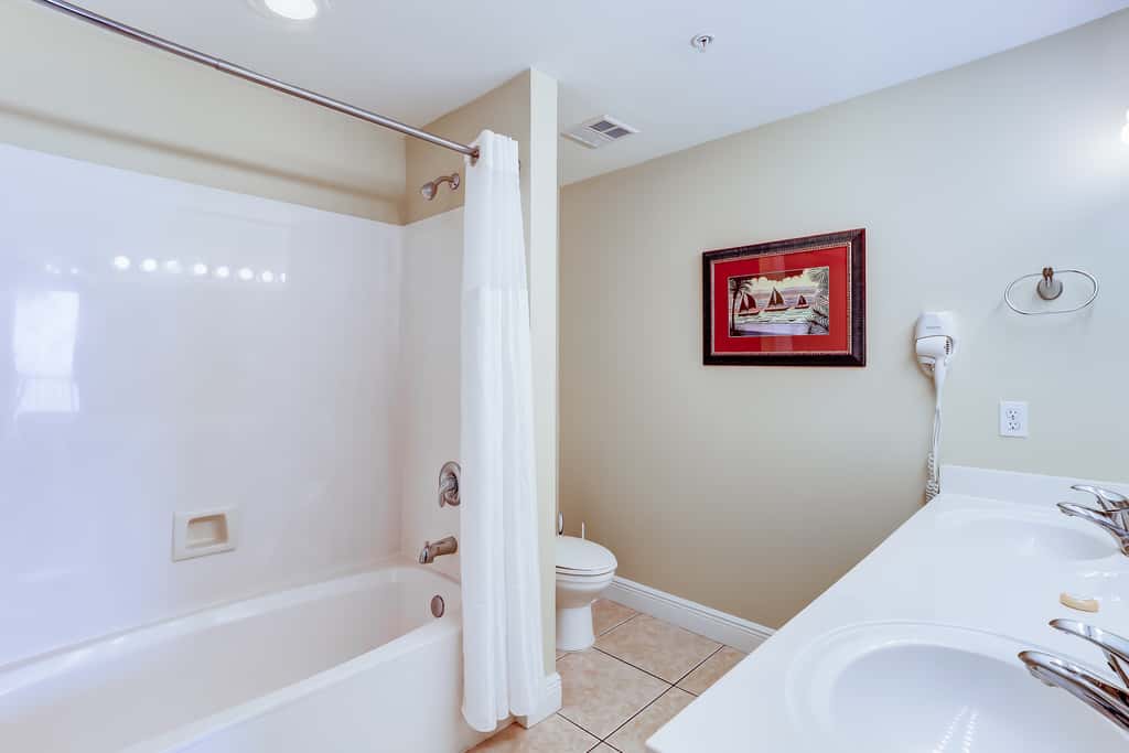 Eclectic gulf front condo with free WiFI, two pools, hot tub, & easy beach access