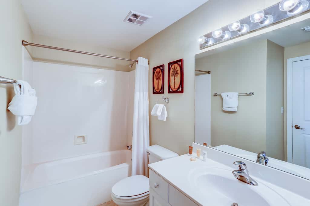 Eclectic gulf front condo with free WiFI, two pools, hot tub, & easy beach access