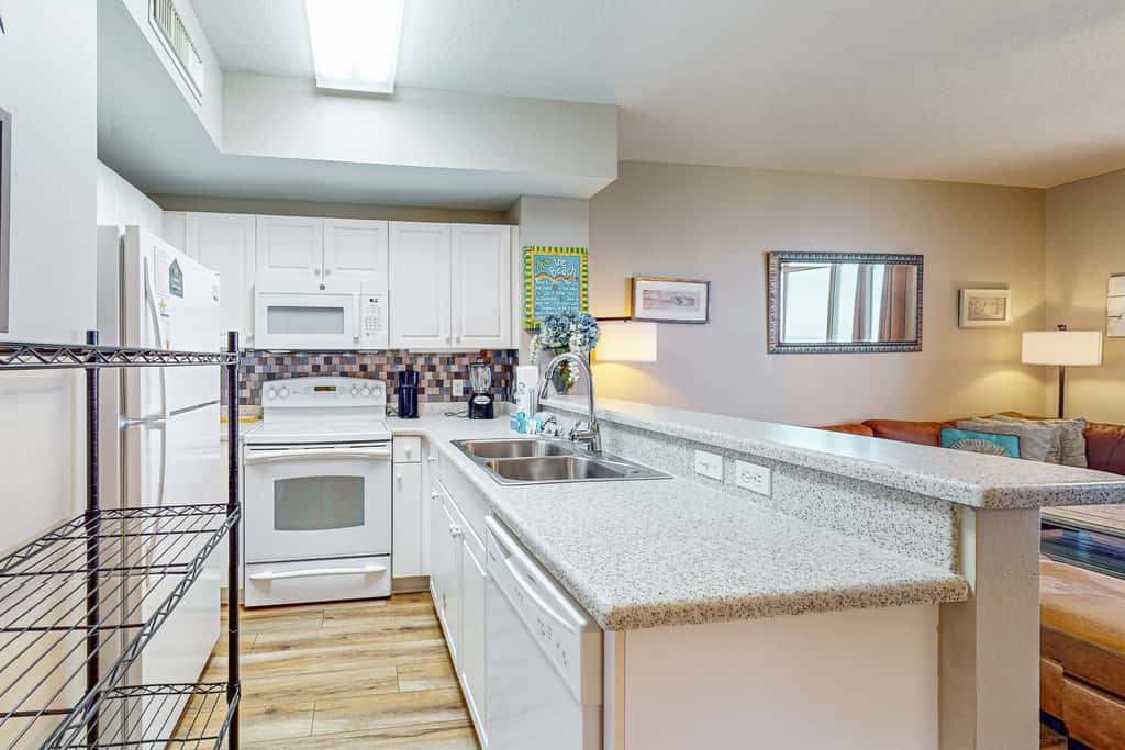 Beachy oceanfront condo with beach access, shared pools and hot tub, & free WiFi