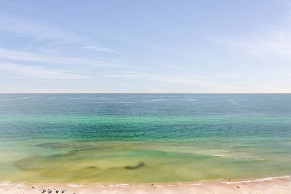 Beachy oceanfront condo with beach access, shared pools and hot tub, & free WiFi