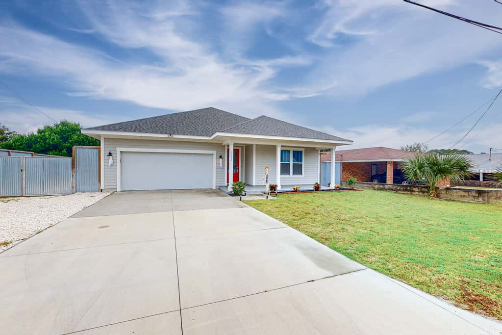 Newer, dog-friendly home with hot tub & game room - walk to the beach