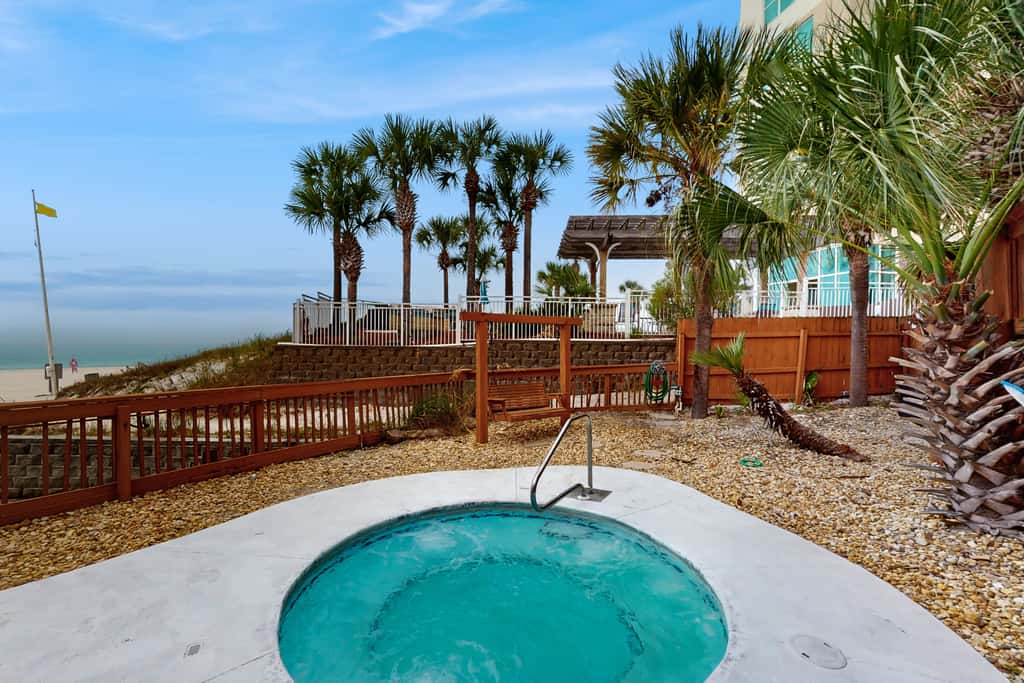 Dog-friendly beachfront condo with pool, hot tub, AC, & Gulf views
