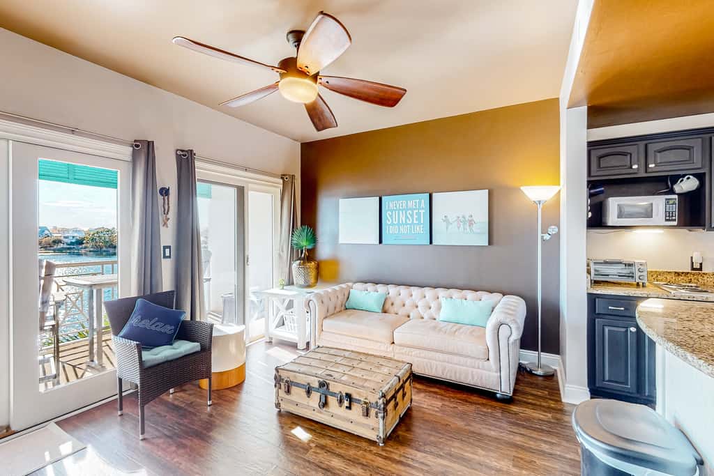Water-view condo with on-site pool, hot tub, beachfront access, & sports courts