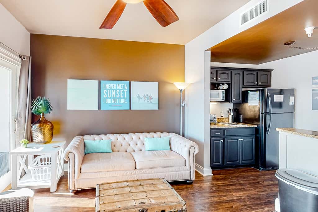 Water-view condo with on-site pool, hot tub, beachfront access, & sports courts