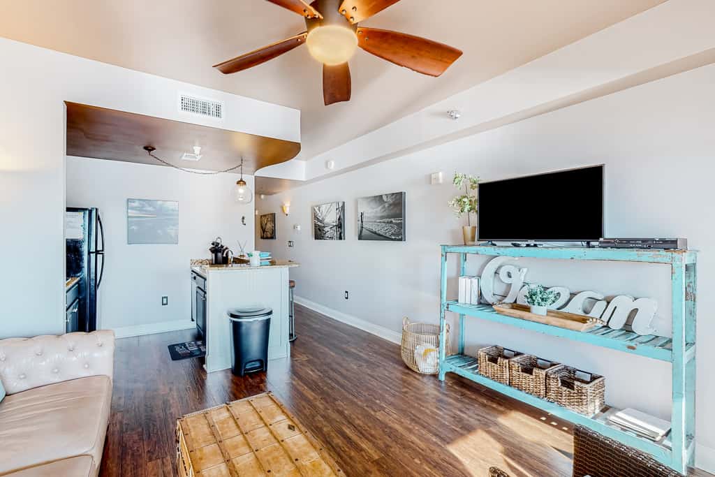 Water-view condo with on-site pool, hot tub, beachfront access, & sports courts