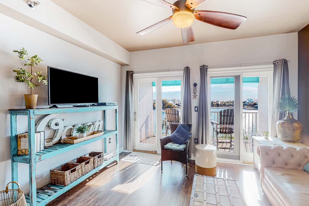 Water-view condo with on-site pool, hot tub, beachfront access, & sports courts