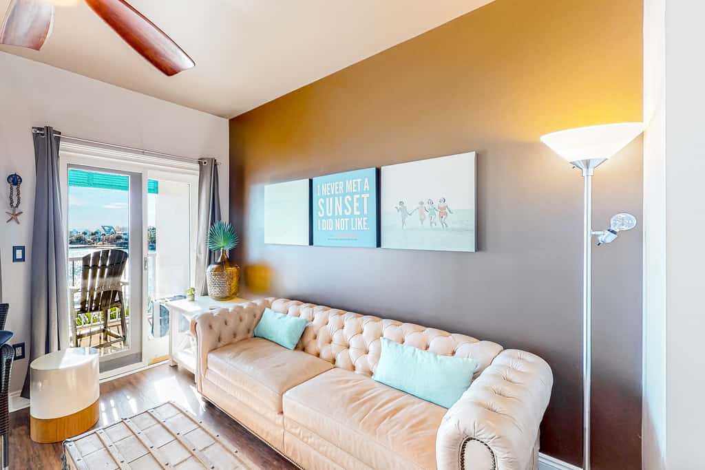 Water-view condo with on-site pool, hot tub, beachfront access, & sports courts