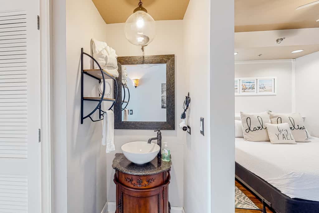 Water-view condo with on-site pool, hot tub, beachfront access, & sports courts