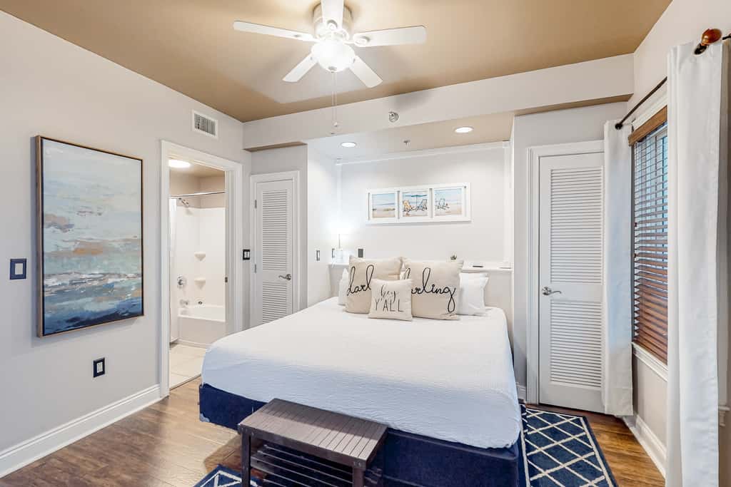 Water-view condo with on-site pool, hot tub, beachfront access, & sports courts