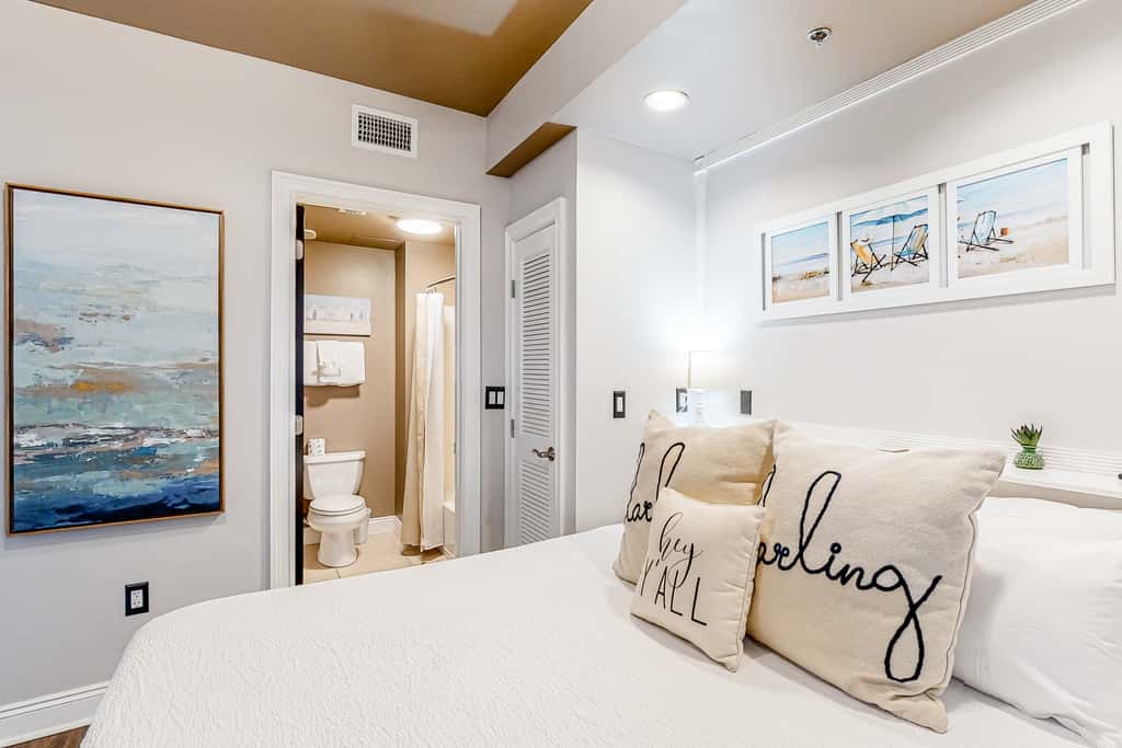 Water-view condo with on-site pool, hot tub, beachfront access, & sports courts