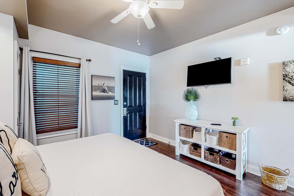 Water-view condo with on-site pool, hot tub, beachfront access, & sports courts