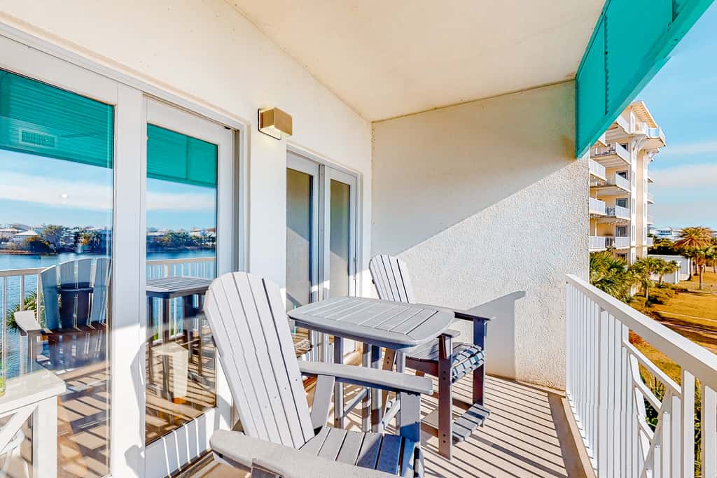 Water-view condo with on-site pool, hot tub, beachfront access, & sports courts