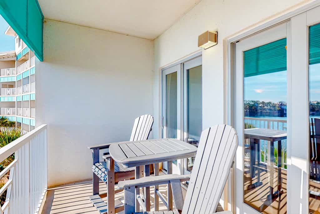 Water-view condo with on-site pool, hot tub, beachfront access, & sports courts