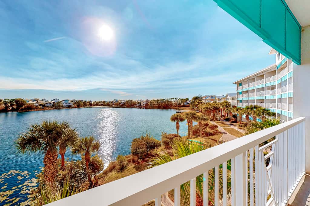 Water-view condo with on-site pool, hot tub, beachfront access, & sports courts