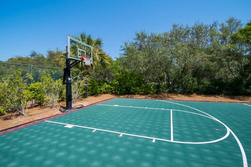 Water-view condo with on-site pool, hot tub, beachfront access, & sports courts