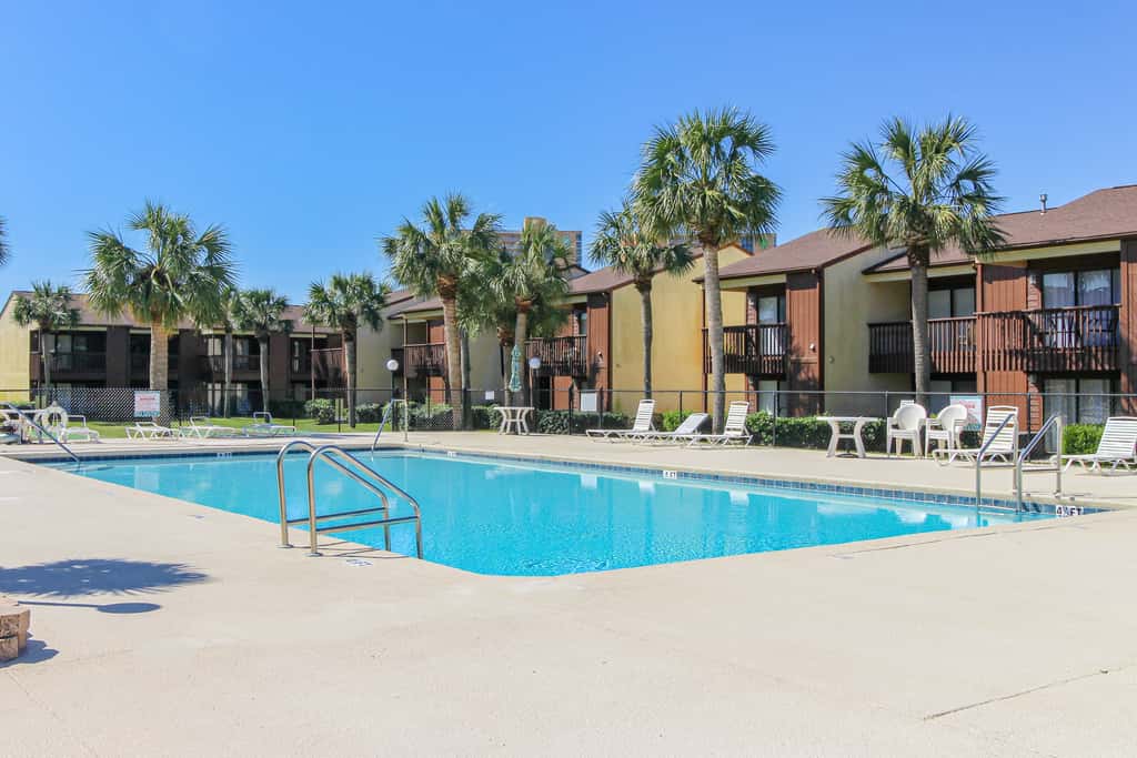 Sunny condo near the sand with pool, hot tub, tennis, smart TV, W&D, & AC
