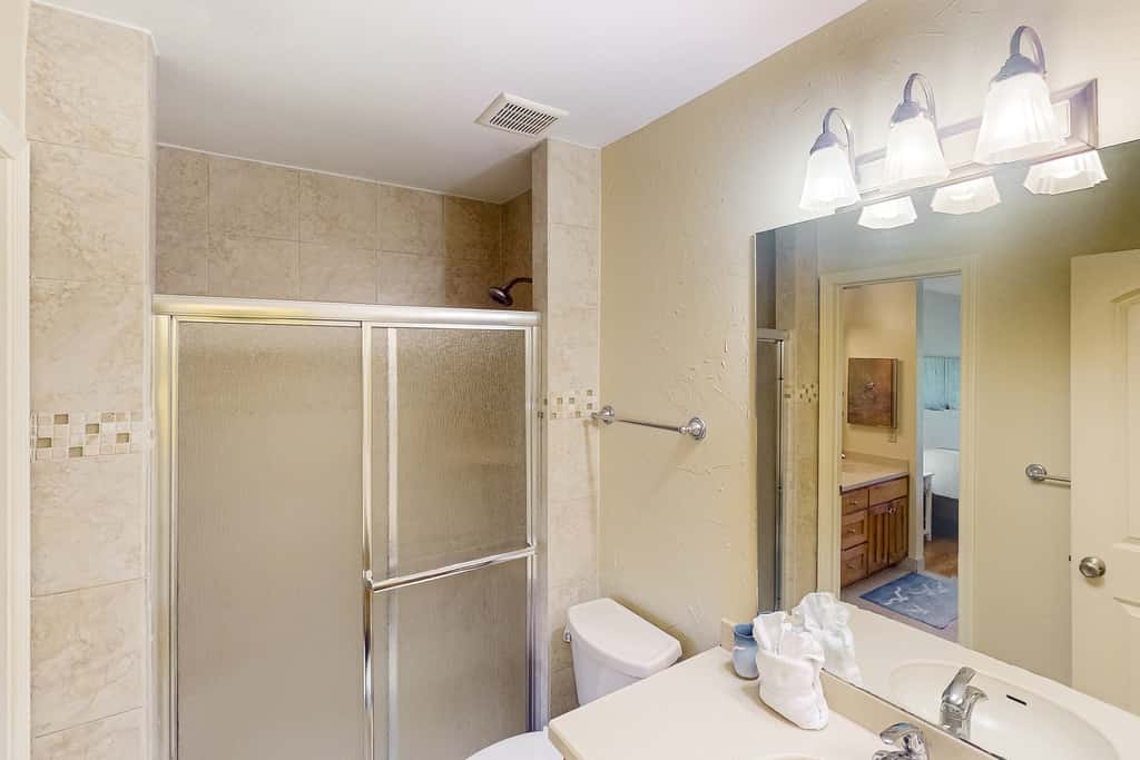 Sunny condo near the sand with pool, hot tub, tennis, smart TV, W&D, & AC