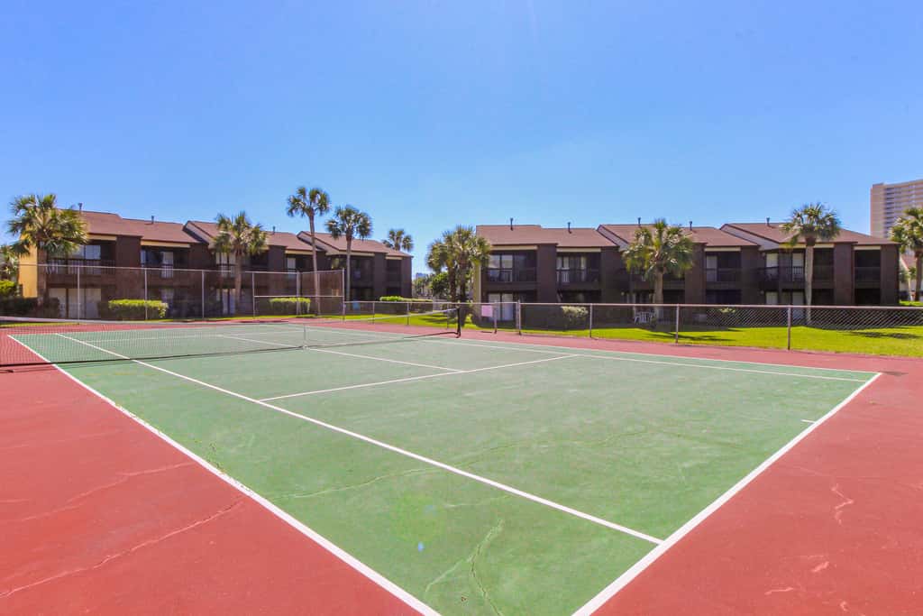 Sunny condo near the sand with pool, hot tub, tennis, smart TV, W&D, & AC