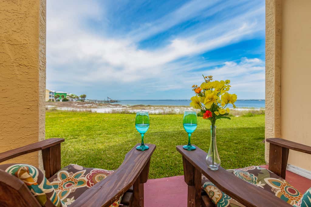 Condo with private balcony, pool, grills, central AC, & WD