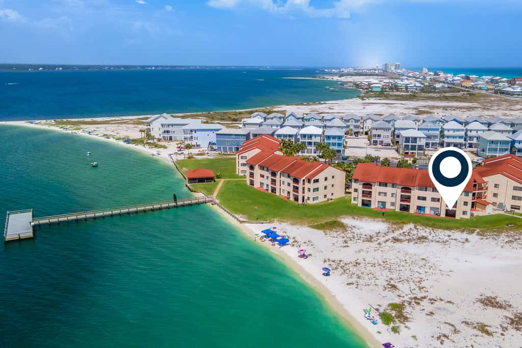Condo with private balcony, pool, grills, central AC, & WD