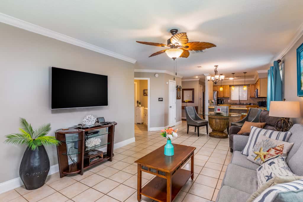 Condo with private balcony, pool, grills, central AC, & WD