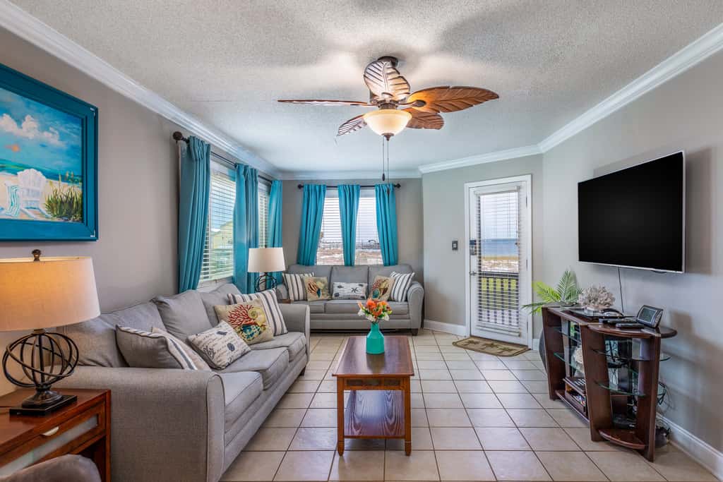 Condo with private balcony, pool, grills, central AC, & WD
