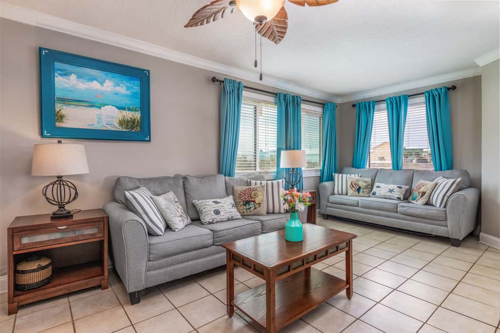 Condo with private balcony, pool, grills, central AC, & WD