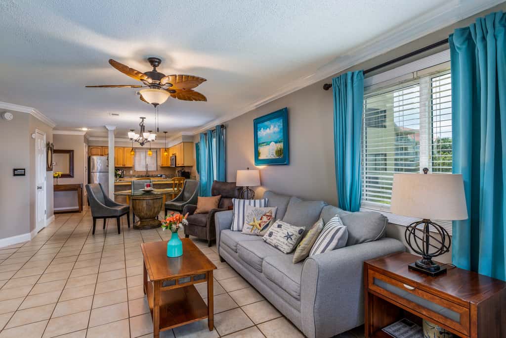 Condo with private balcony, pool, grills, central AC, & WD
