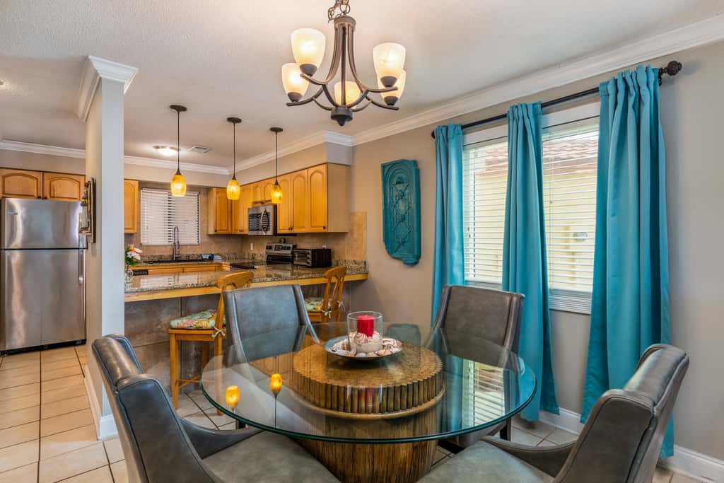 Condo with private balcony, pool, grills, central AC, & WD