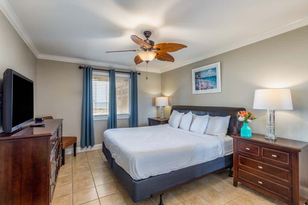 Condo with private balcony, pool, grills, central AC, & WD