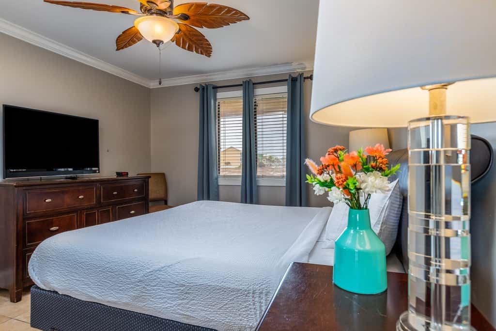 Condo with private balcony, pool, grills, central AC, & WD
