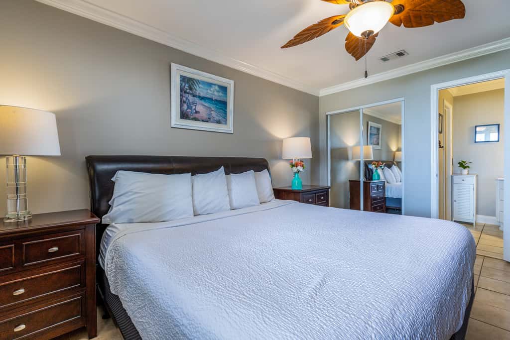 Condo with private balcony, pool, grills, central AC, & WD