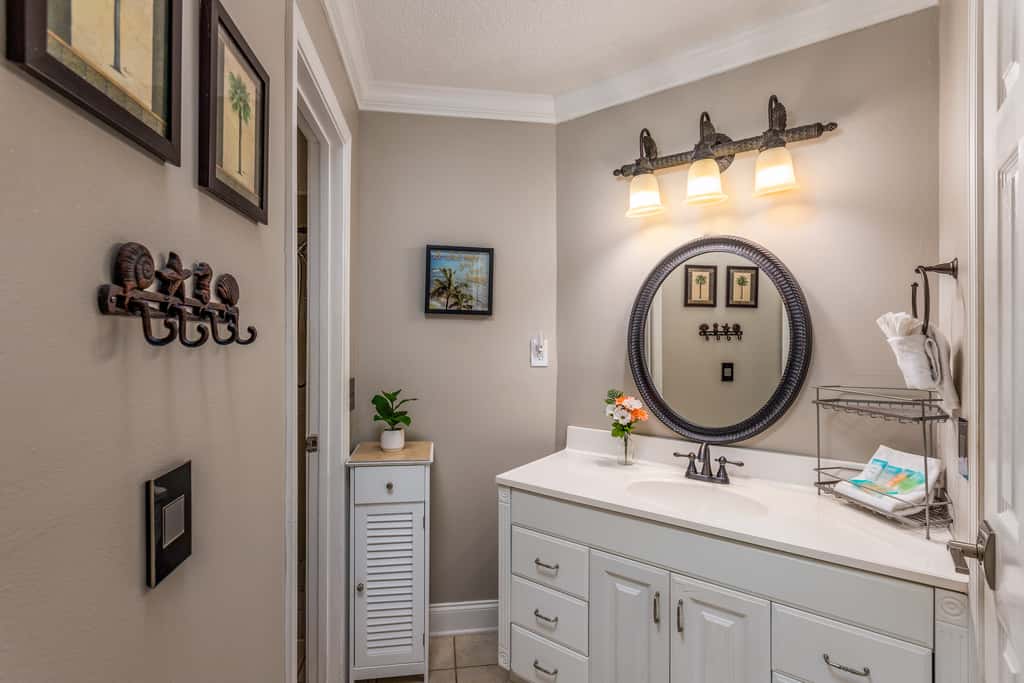 Condo with private balcony, pool, grills, central AC, & WD