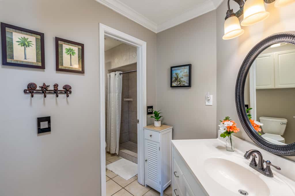 Condo with private balcony, pool, grills, central AC, & WD