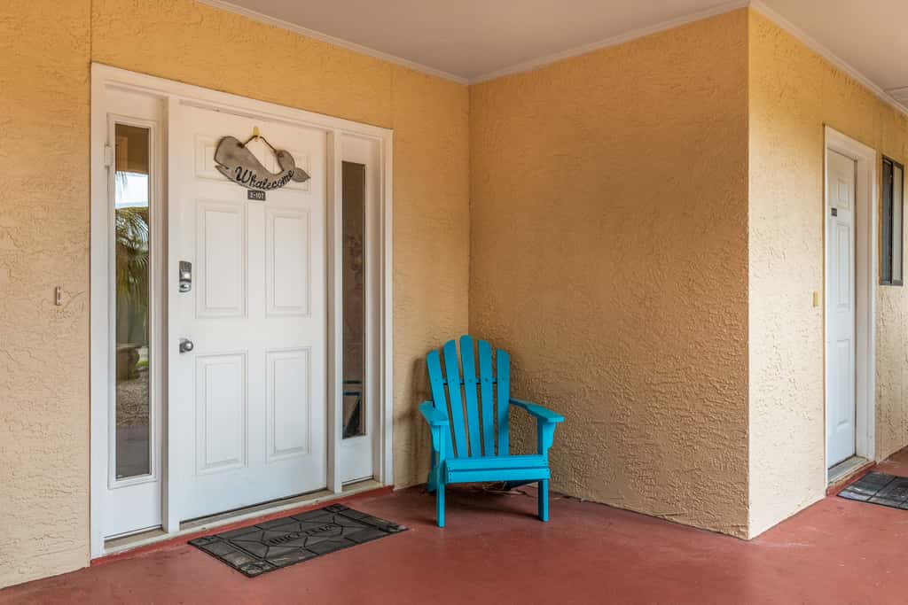 Condo with private balcony, pool, grills, central AC, & WD
