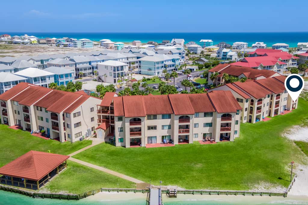 Condo with private balcony, pool, grills, central AC, & WD