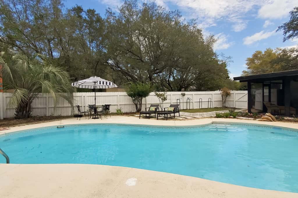 Updated dog-friendly home with private outdoor pool, patio, fireplace, W&D, AC